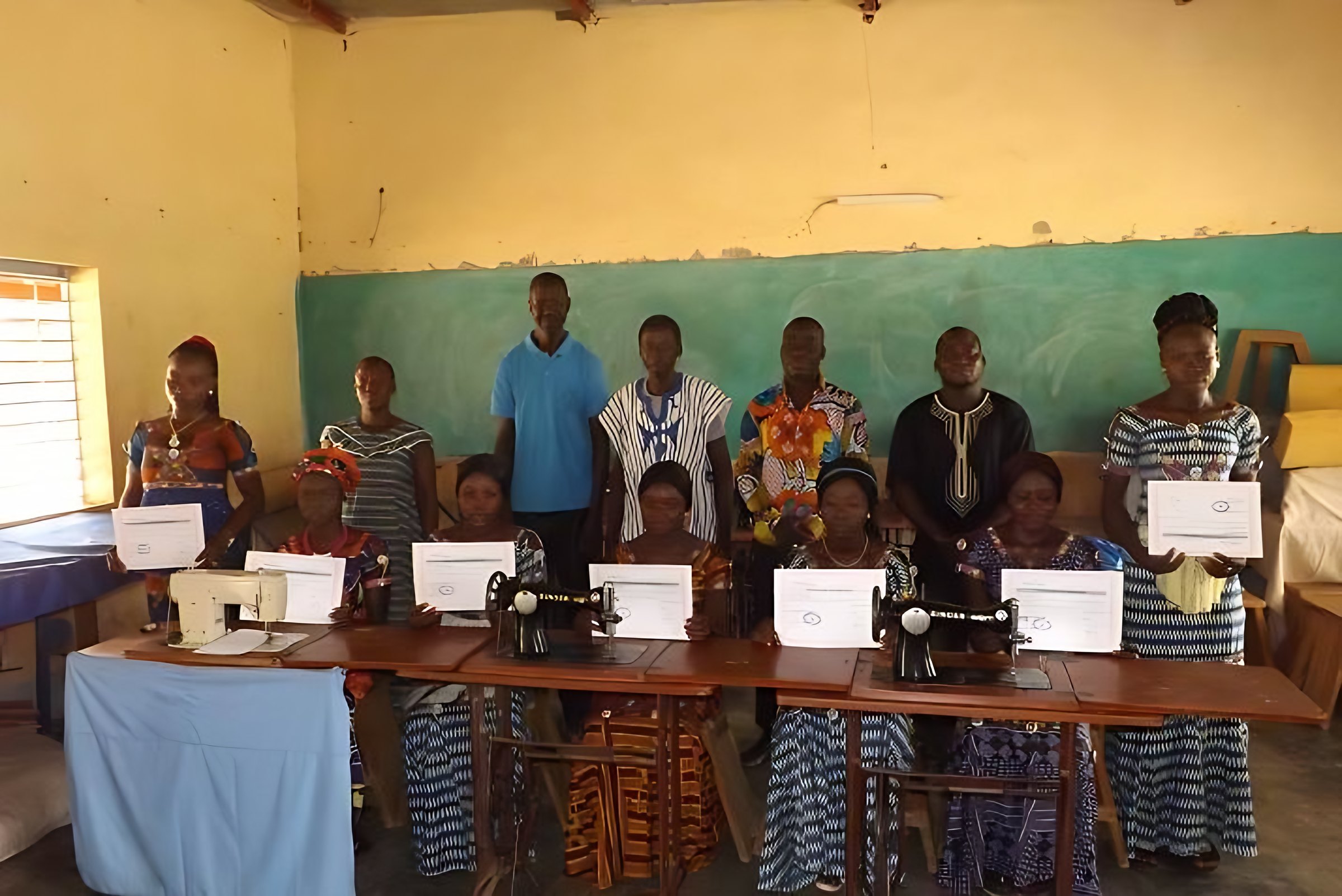 Needlework graduates with their certificates in Burkina Faso