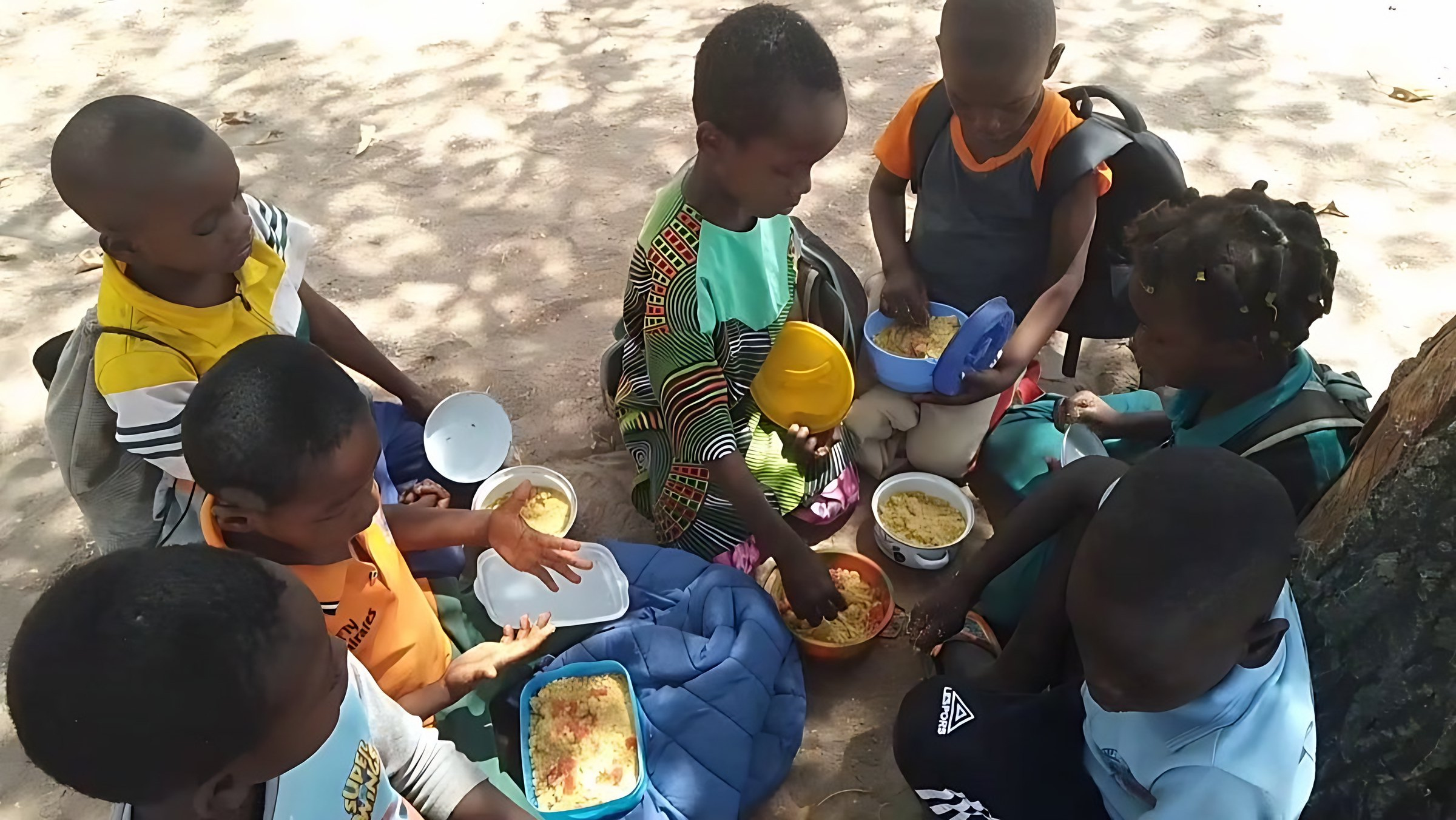 Children sharing lunch from the school canteen